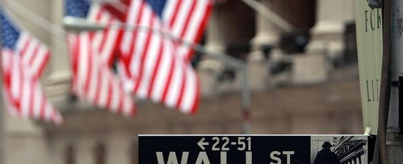 A Wall St. sign next to the New York Stock Exchange Vancouver Sun | James Alexander Michie